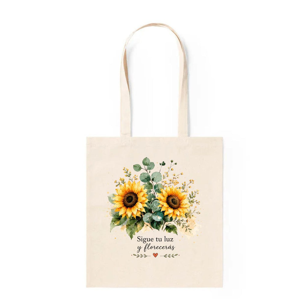 Bolsa de tela crema con girasoles en acuarela y texto Sigue tu luz y florecerás